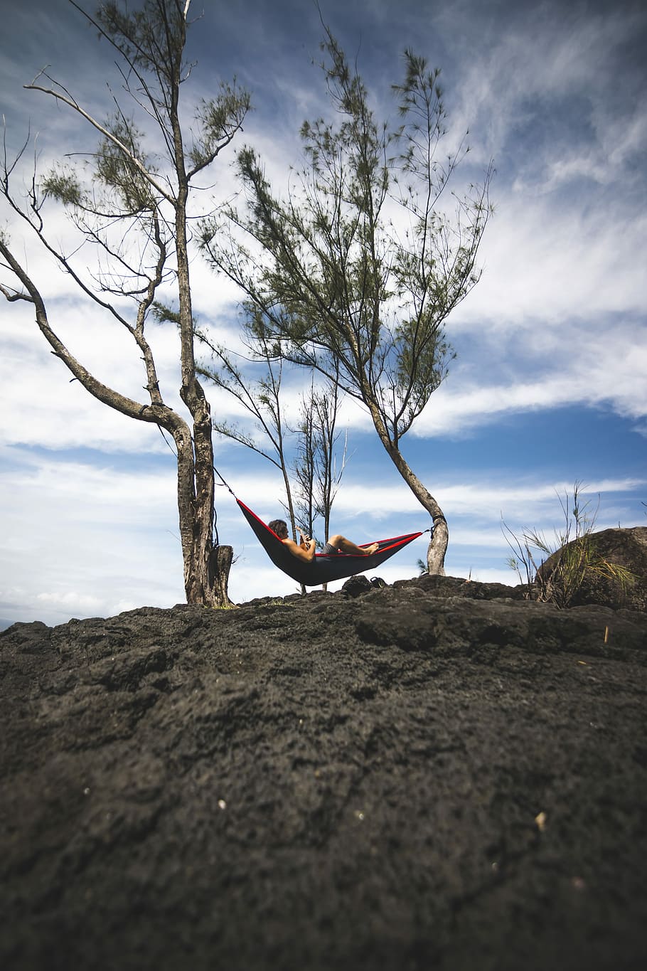person lying on black and red hammock during daytime, person lying on red hammock HD wallpaper