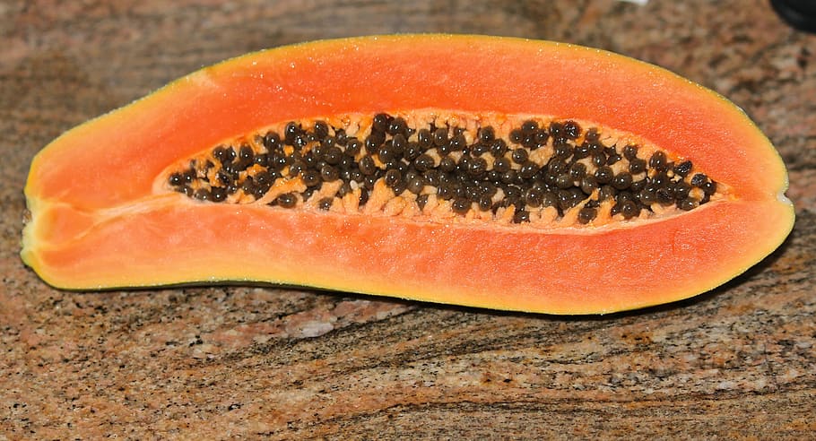 slice of papaya fruit on brown surface, tropical fruit, pawpaw, HD wallpaper
