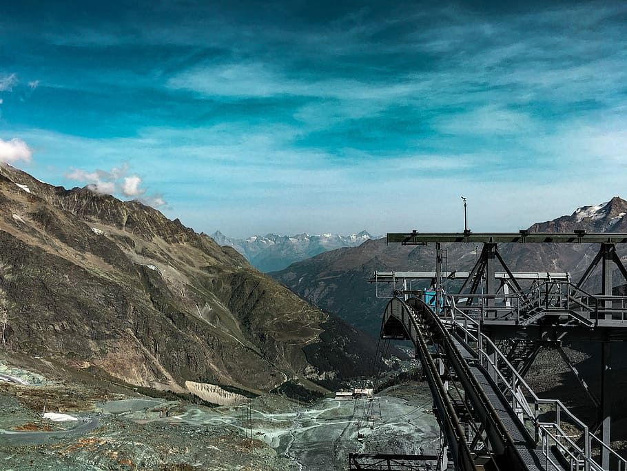 concrete bridge over body of water, cable car facility in mountain range HD wallpaper