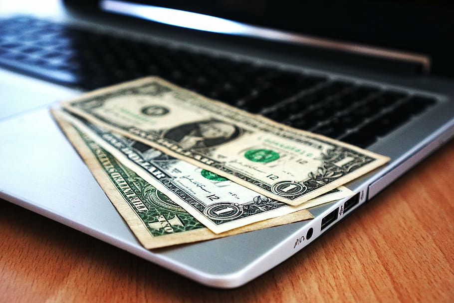three 1 U.S. dollar banknotes on MacBook Pro, computer, buy, money, HD wallpaper