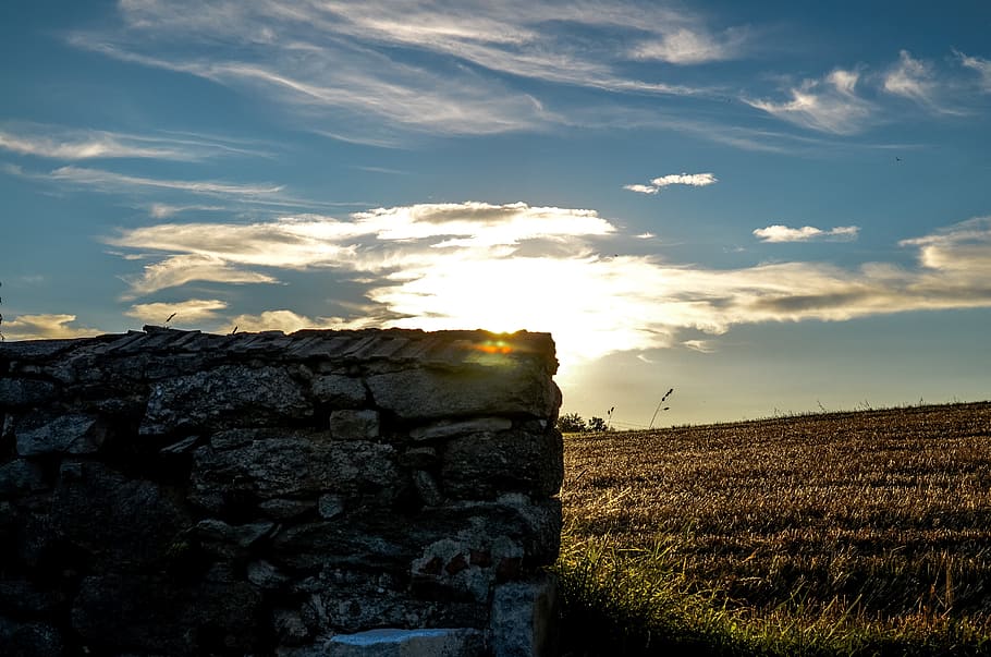 wall, field, sun, brick, facade, sunbeam, land, twilight, sky HD wallpaper