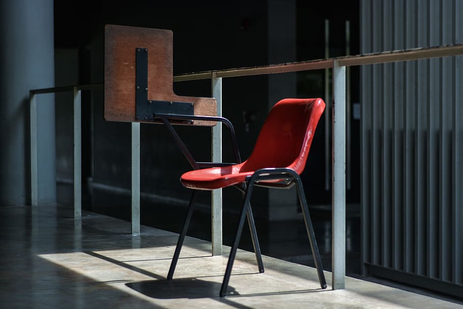gray and red chair near the glass wall, writing chair beside fence HD wallpaper