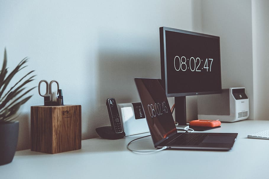 turned on computer monitor and laptop with 08:02:47 on screens, black laptop computer near flat screen monitor HD wallpaper