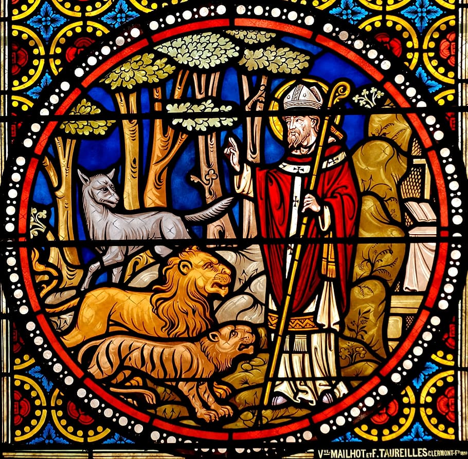 religious man surrounded by three animals wall decor, stained glass