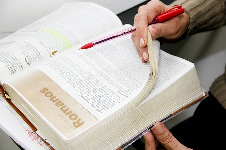 Person holding a ballpoint pen and a book, reading, bible, apostolic HD wallpaper