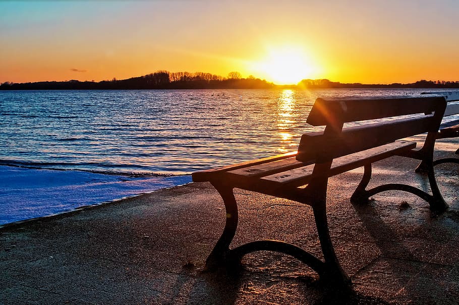 bench near ocean, lake, sunset, sky, water, sunlight, beauty in nature HD wallpaper