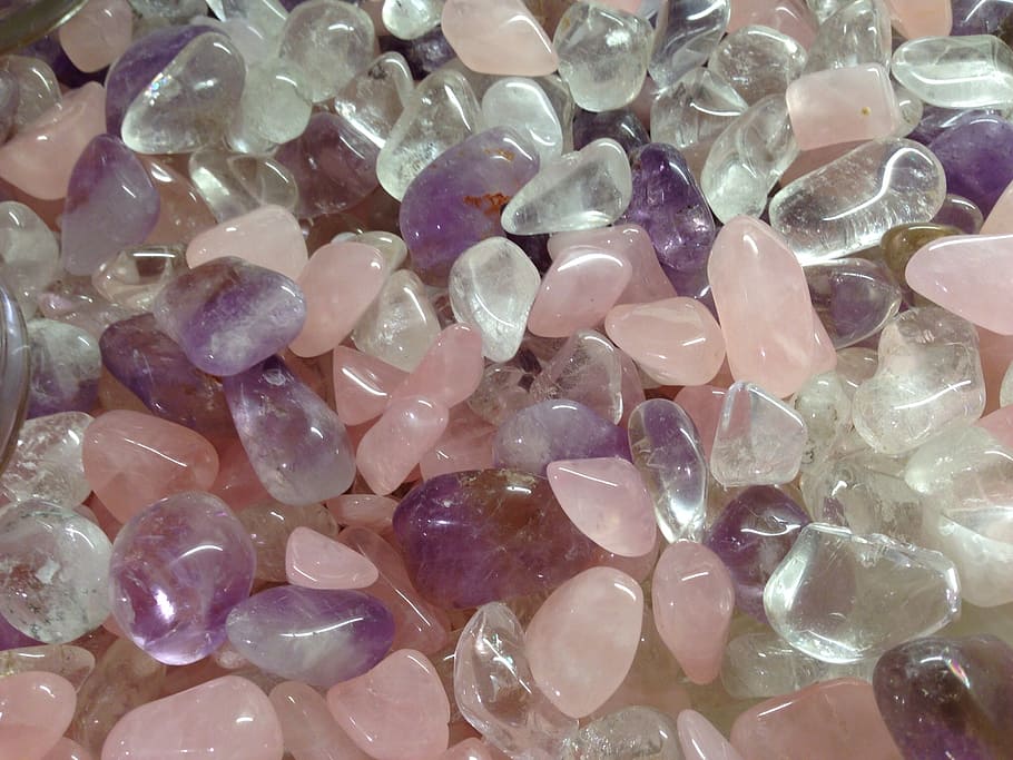 closeup photo of pink, clear, and purple beads, amethyst, rock crystal