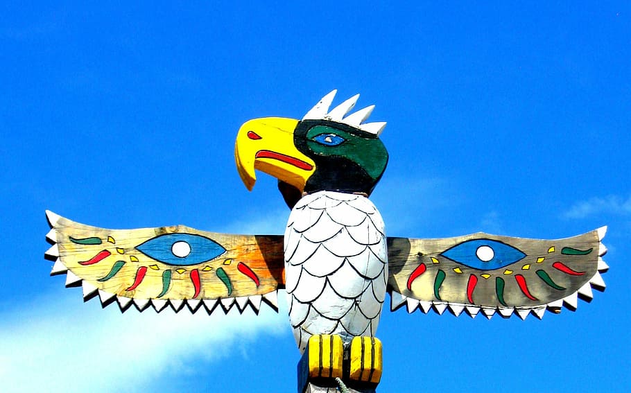 multicolored wooden eagle totem statue, pole, bird, wings, native