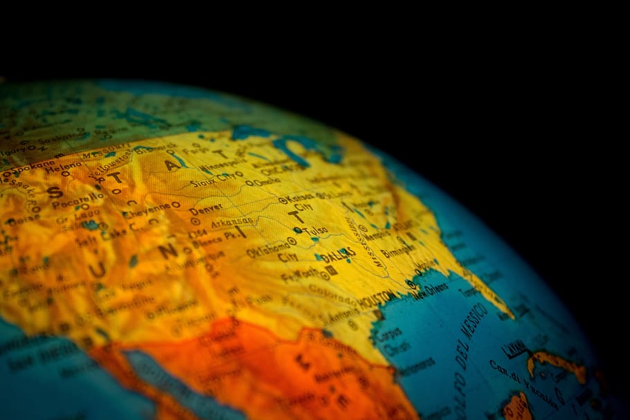 closeup photo of desk globe showing map of USA, blur, close-up HD wallpaper