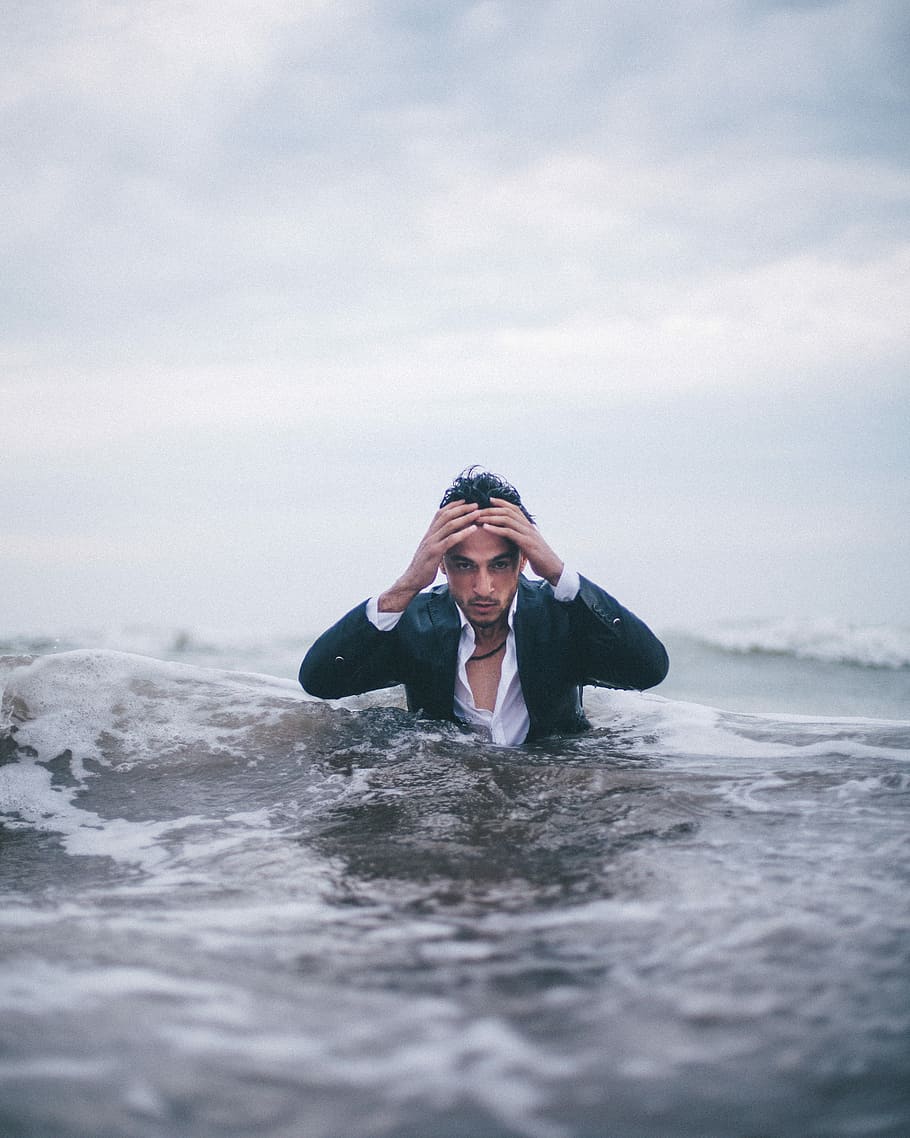 man on body of water during daytime, man in middle of body of water under cloudy sky HD wallpaper