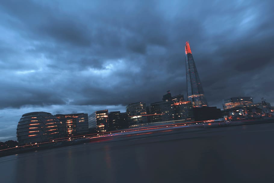 dark, cloudy, sea, water, ocean, buildings, tower, skyline HD wallpaper