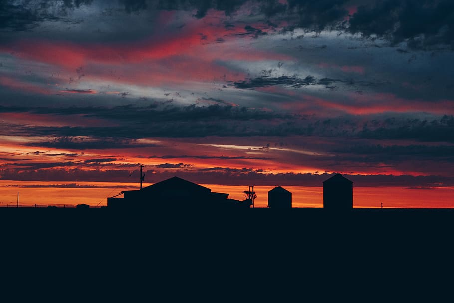 silhouette of house during sunset, silhouette photography of house and two silos during golden hour HD wallpaper
