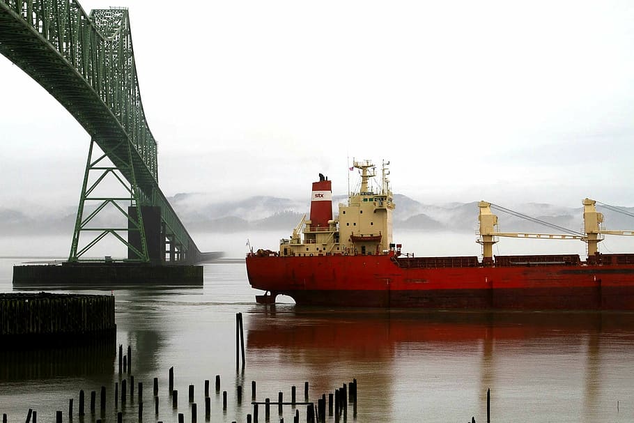 red and white boat under grey metal bridge during cloudy day HD wallpaper