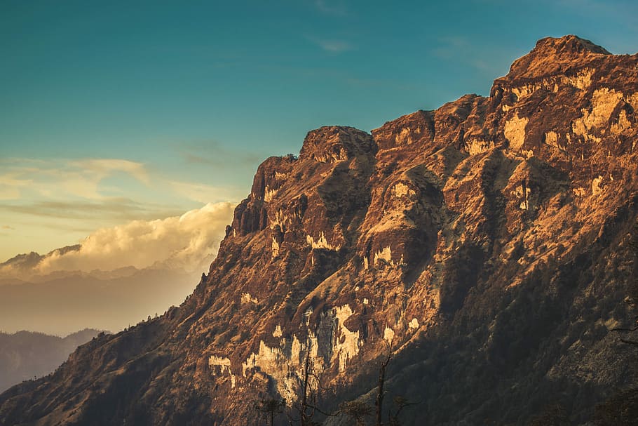 bird's-eye view of mountain across white clouds, photo of mountain during daytime HD wallpaper