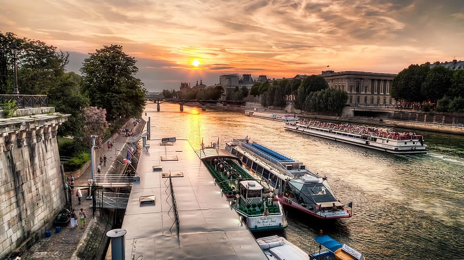 boats on river near trees during sunset, paris, seine river, sky