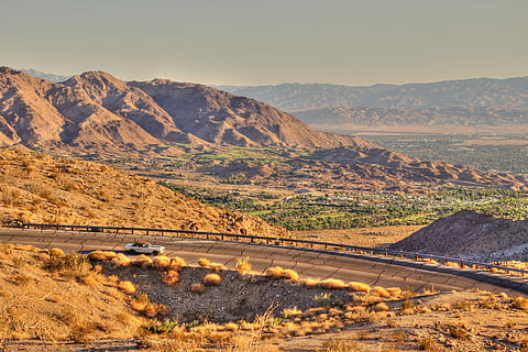 Highway outside Palm Springs, white vehicle travelling on road at daytime HD wallpaper