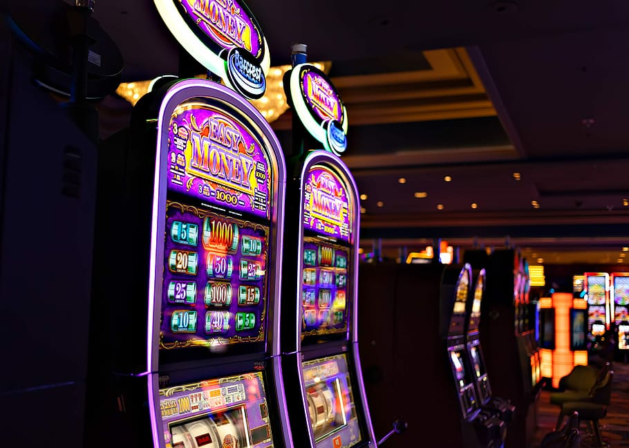 HD wallpaper: One Arm Bandit, multicolored East Money slot machines, night  | Wallpaper Flare