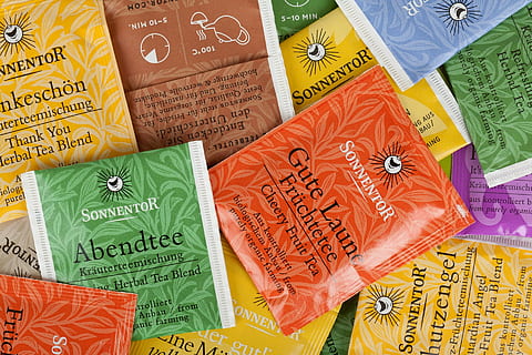 assorted Sonnentor tea packets, abstract, background, tea bag HD wallpaper