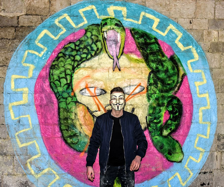 man wearing mask standing near wall, graffiti, the construction HD wallpaper