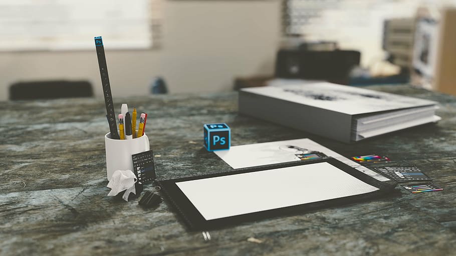 white ceramic mug near white printer paper and grey binders HD wallpaper