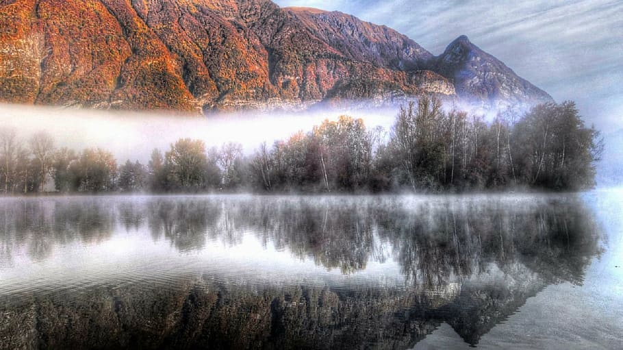 calm lake near orange mountain during daytime, fog, reflection HD wallpaper