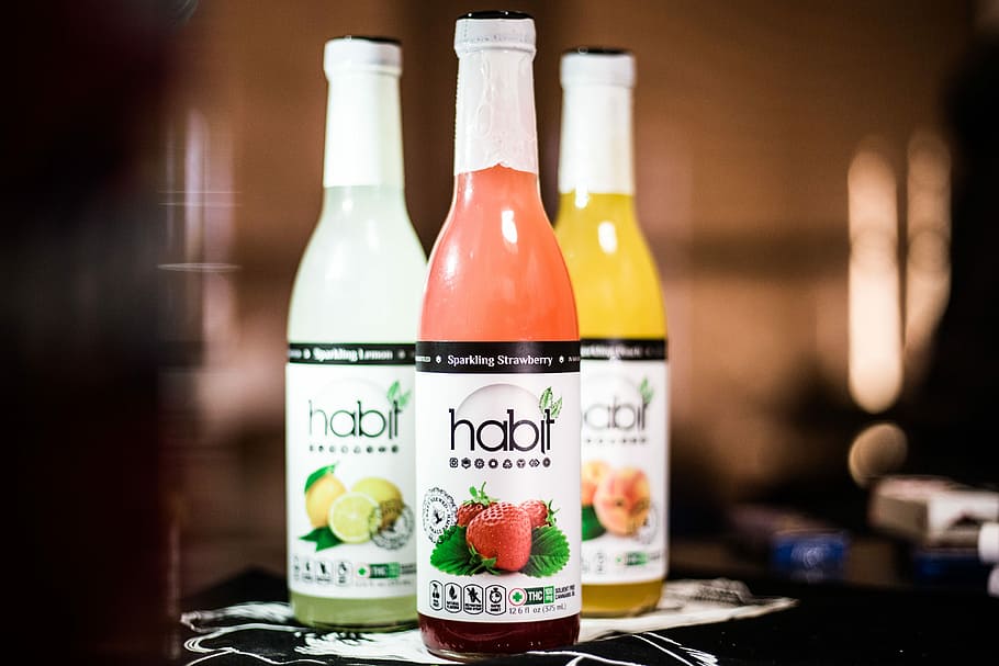 closeup photo of three sealed Habit labeled bottles, three Habit bottles HD wallpaper