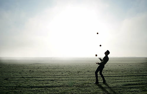 man juggling on clear field, juggler, trick, apple, person HD wallpaper