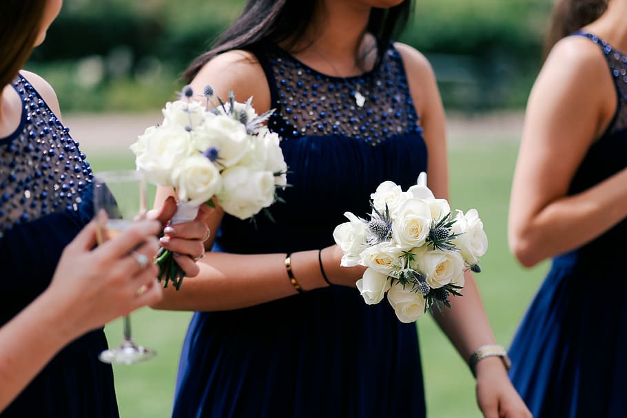 Bridesmaids and Bouquet, two women holding white petaled flowers HD wallpaper