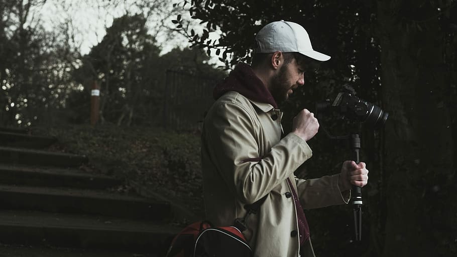 Wonder round Liverpool, person holding camera tripod while looking at camera HD wallpaper