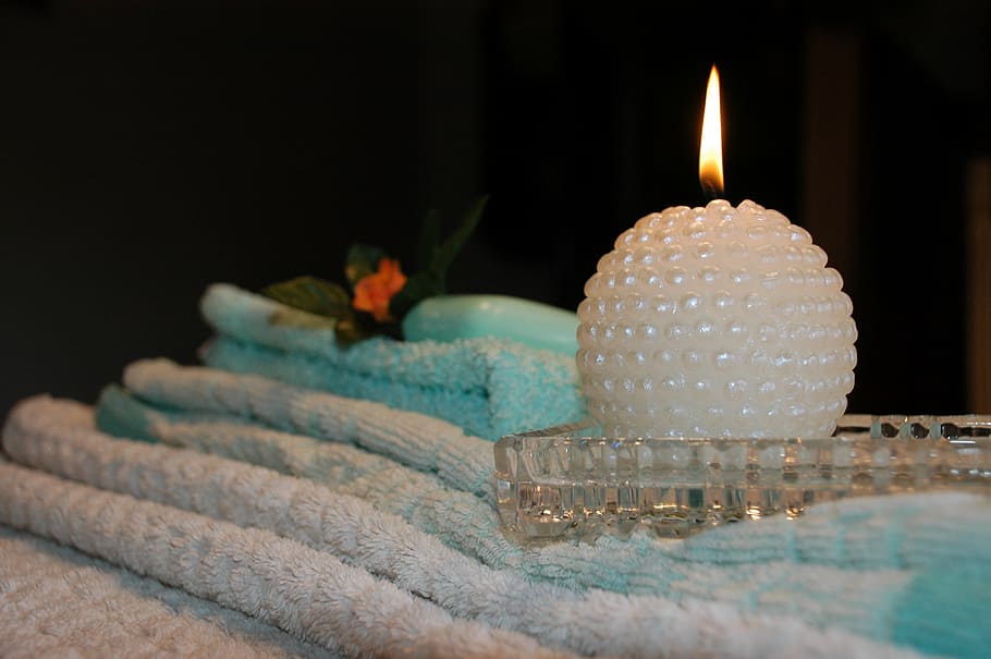 round white pearl tealight candle on clear cut glass holder HD wallpaper