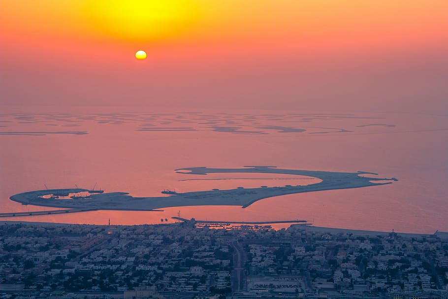 overlooking photography of city and isles during sunset, dusk HD wallpaper