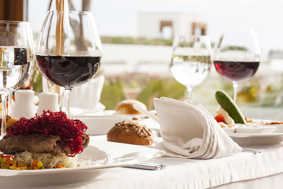 food on plate with wine glasses on table closeup photo, restaurant HD wallpaper