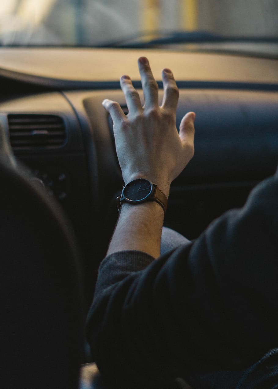 selective focus photography of person wearing round black analog watch HD wallpaper
