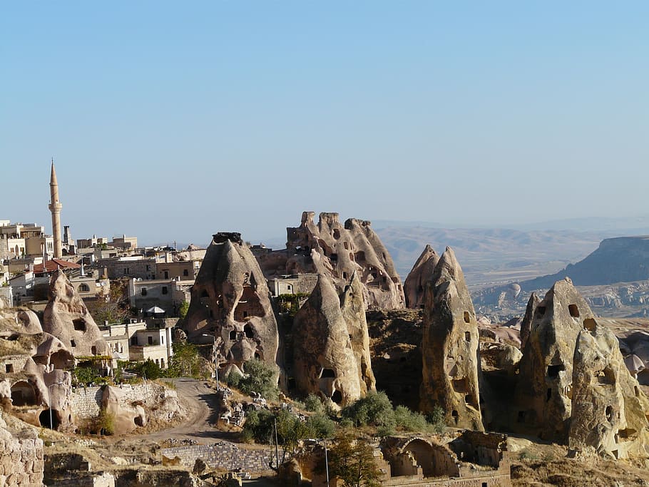 Birds-eye photography of houses, uchisar, minaret, tuff stone dwellings