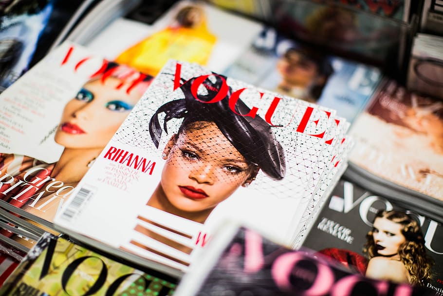 Vogue Rihanna magazine beside magazines, pile of assorted Vogue magazine