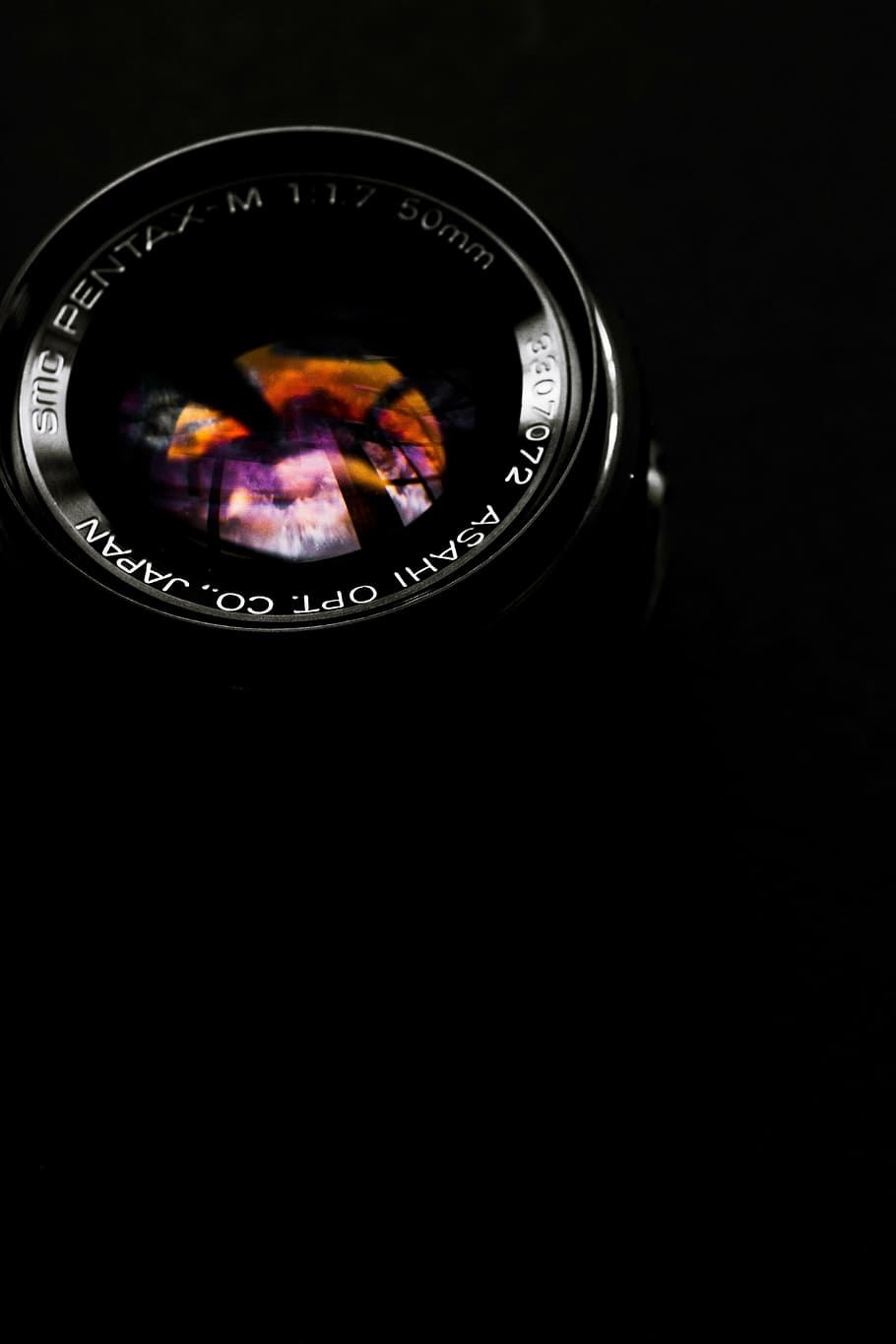 50mm black camera lens with black background closeup photo HD wallpaper