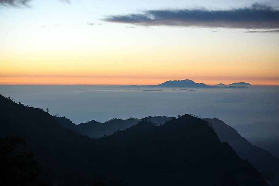 black mountain under orange sunset, silhouette of mountain under cloudy sky HD wallpaper