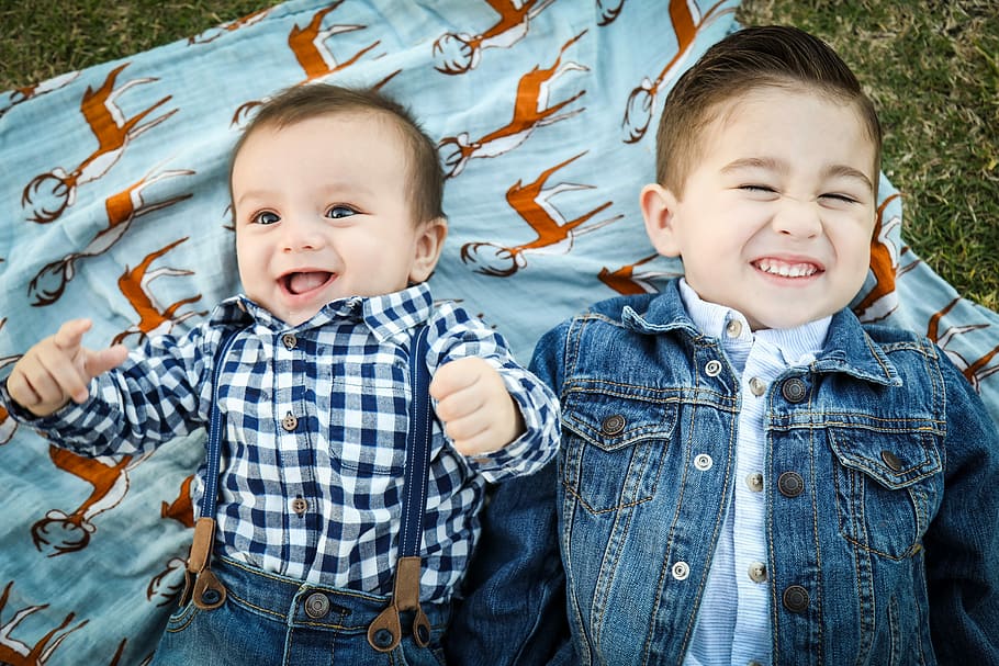 two boys laying on blue textile, baby boy and toddler boy lying next to each other, HD wallpaper