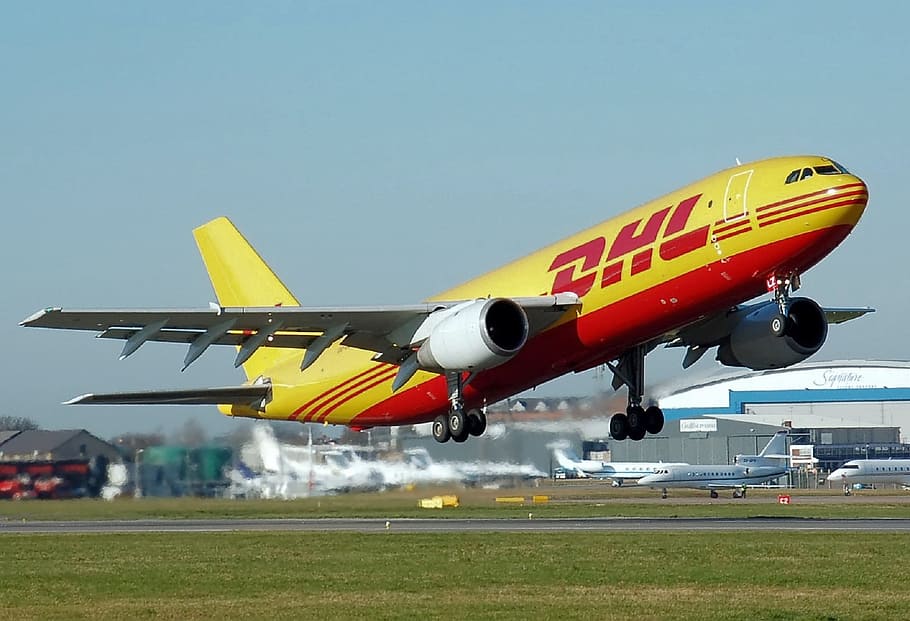 yellow DHL airplane taking off, Aircraft, Commercial, freighter