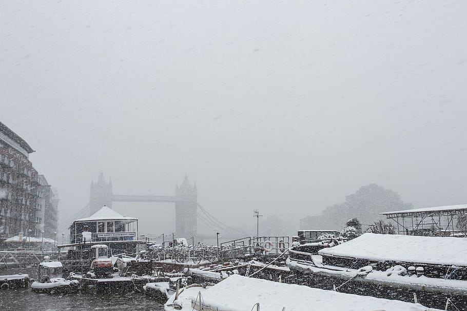 Tower Bridge masked by a Blizzard, grayscale photo of boats on body of water HD wallpaper