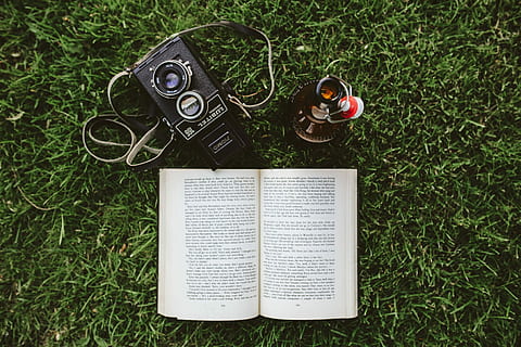 Book on the grass, reading, leaf, literature, outdoors, camera - Photographic Equipment HD wallpaper