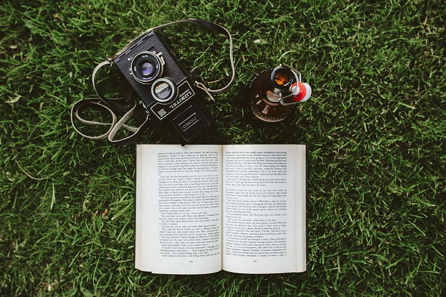 Book on the grass, reading, leaf, literature, outdoors, camera - Photographic Equipment HD wallpaper
