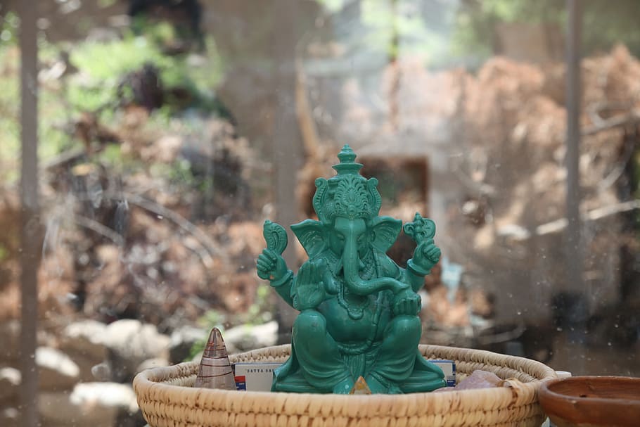 jade Ganesha statue placed on basket, vinayaka, ganapati, god