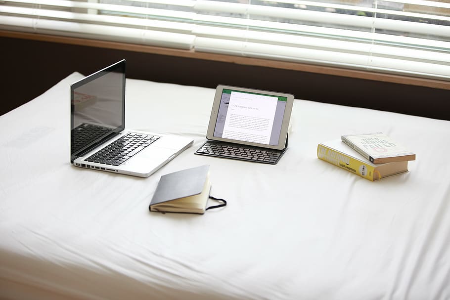 MacBook Pro beside white iPad, laptop, notebook, technology HD wallpaper