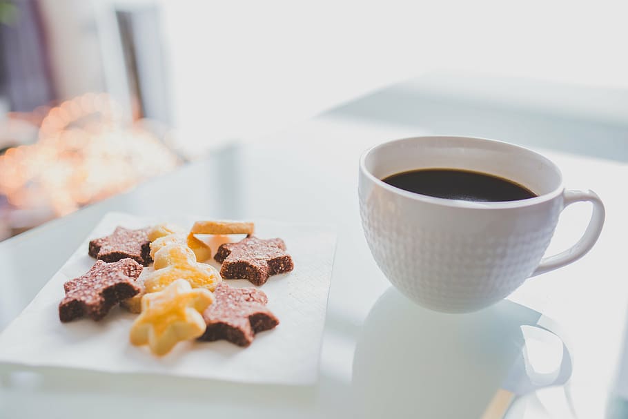 several star cookies on square white ceramic dish beside coffee filled white milk glass hobnail mug on top of table HD wallpaper