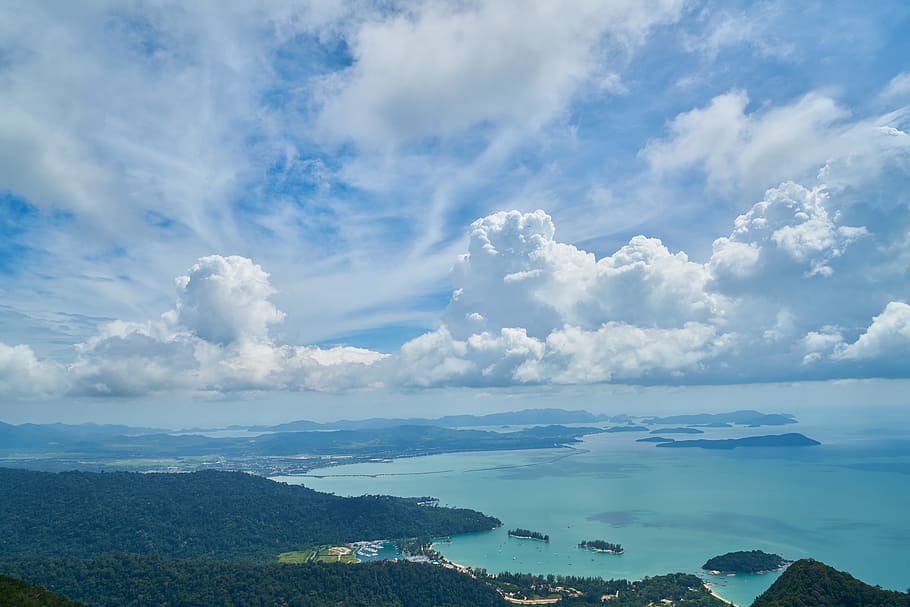 aerial photography of green mountain surrounded by body of water HD wallpaper
