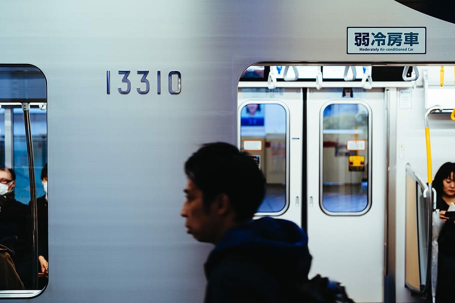 man walking beside train, man walking on train, subway, metro HD wallpaper