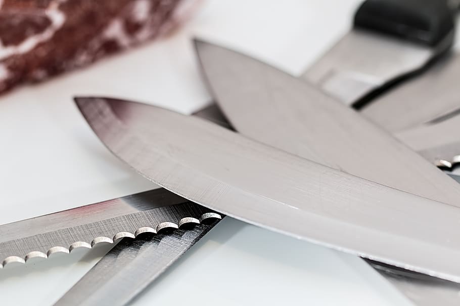selective focus photography of kitchen knives on white surface HD wallpaper