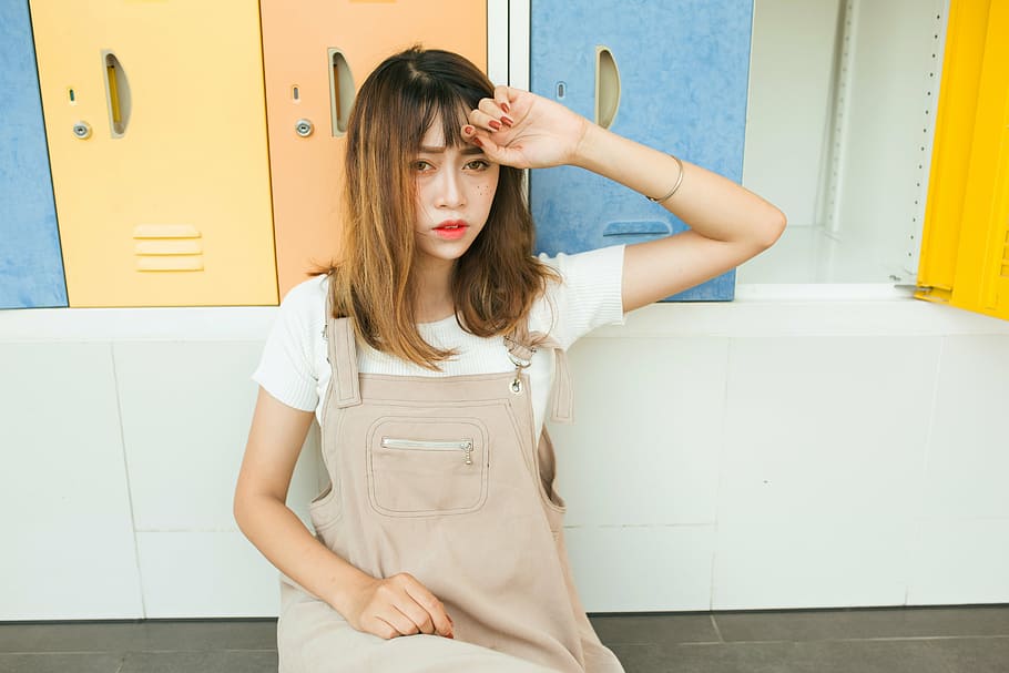 woman wearing brown dungaree sitting on brown bench, girl, beautiful