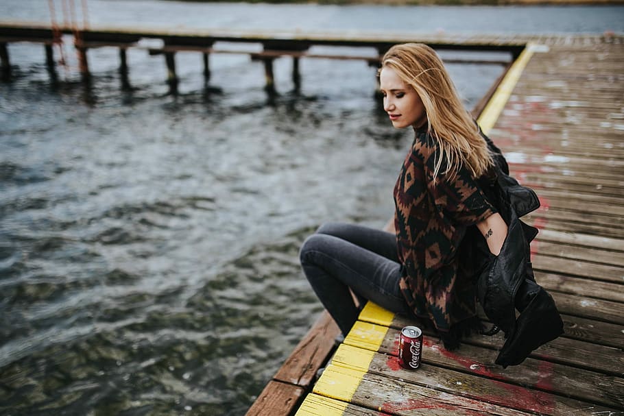 Beautiful blonde woman on a wooden pier by the lake, female, girl